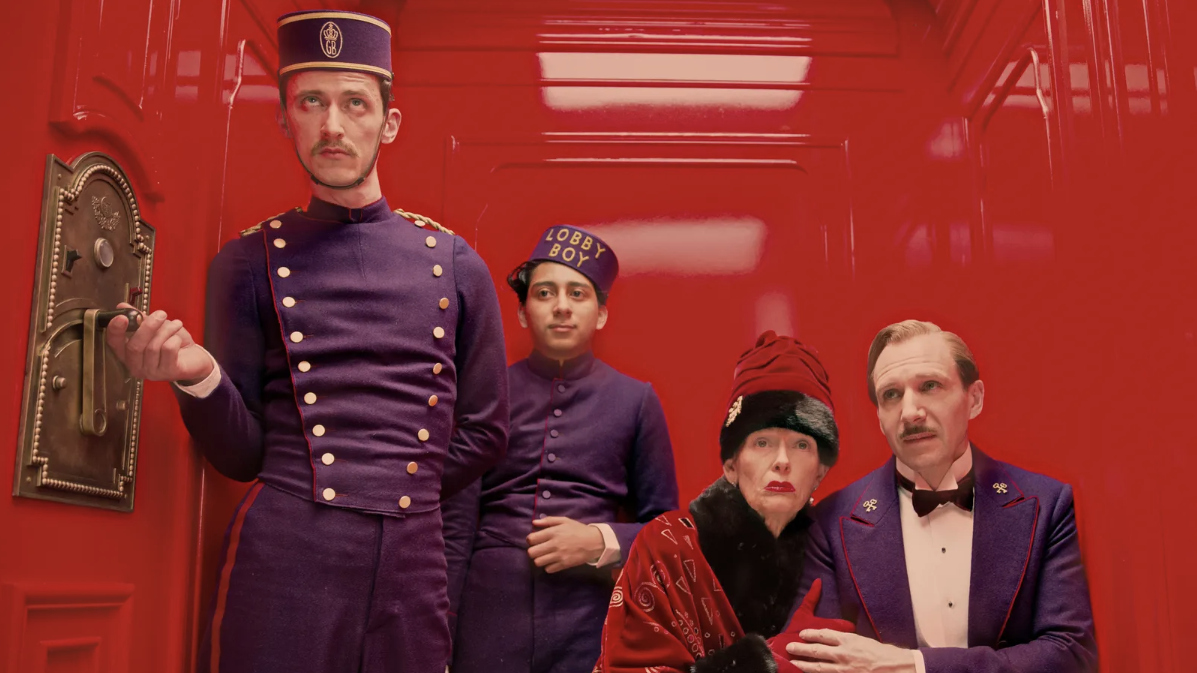 Still from Wes Anderson film, The Grand Hotel Budapest, showing people in a red elevator