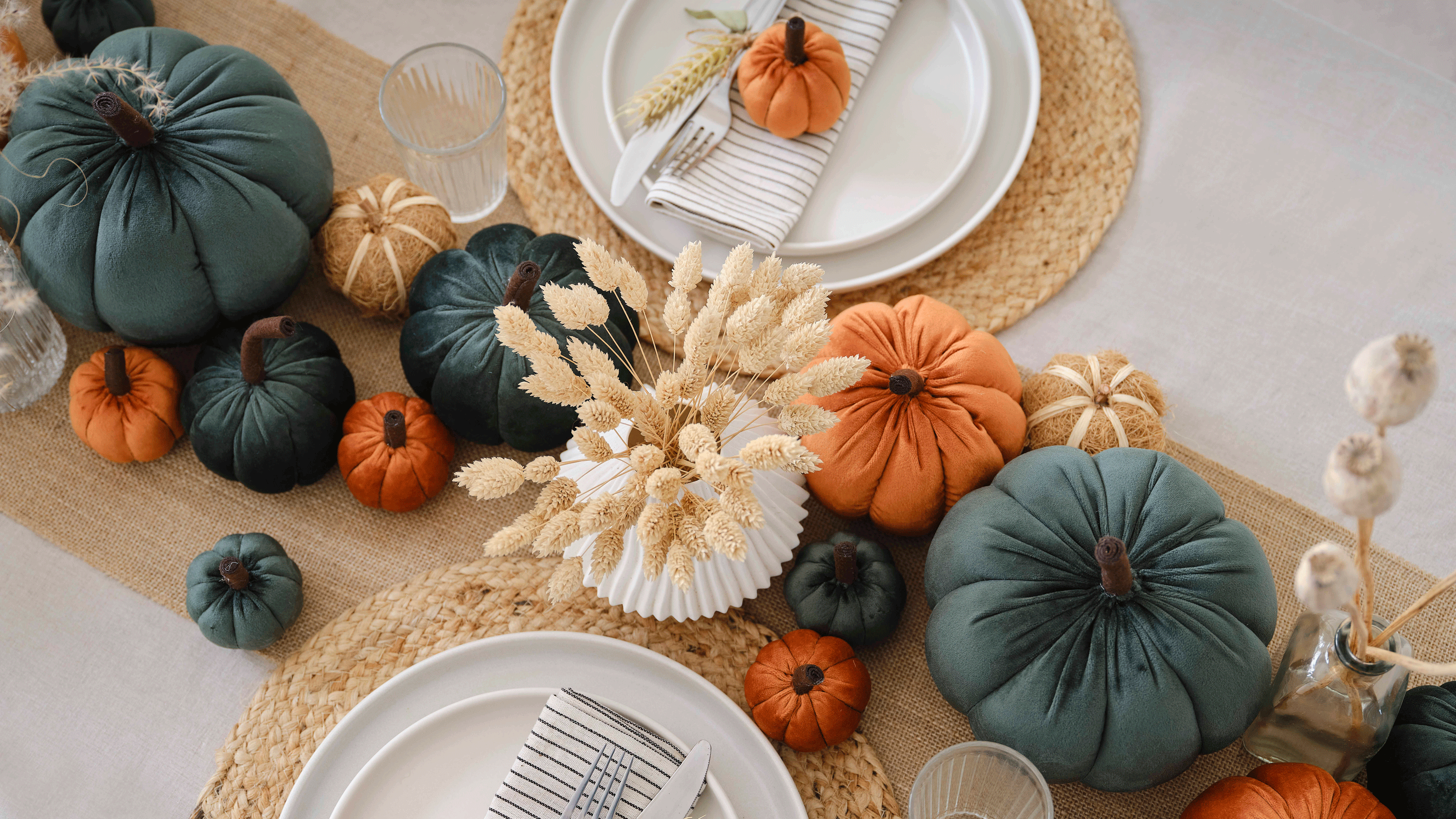 Orange and blue plush pumpkins on table