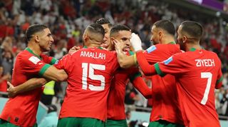 Morocco players celebrate their goal against Portugal at World Cup 2022.