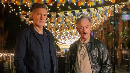 David Morrissey and Alan Cumming stand in Manchester's Canal Street