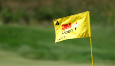 A 3M Open flag flutters in the wind