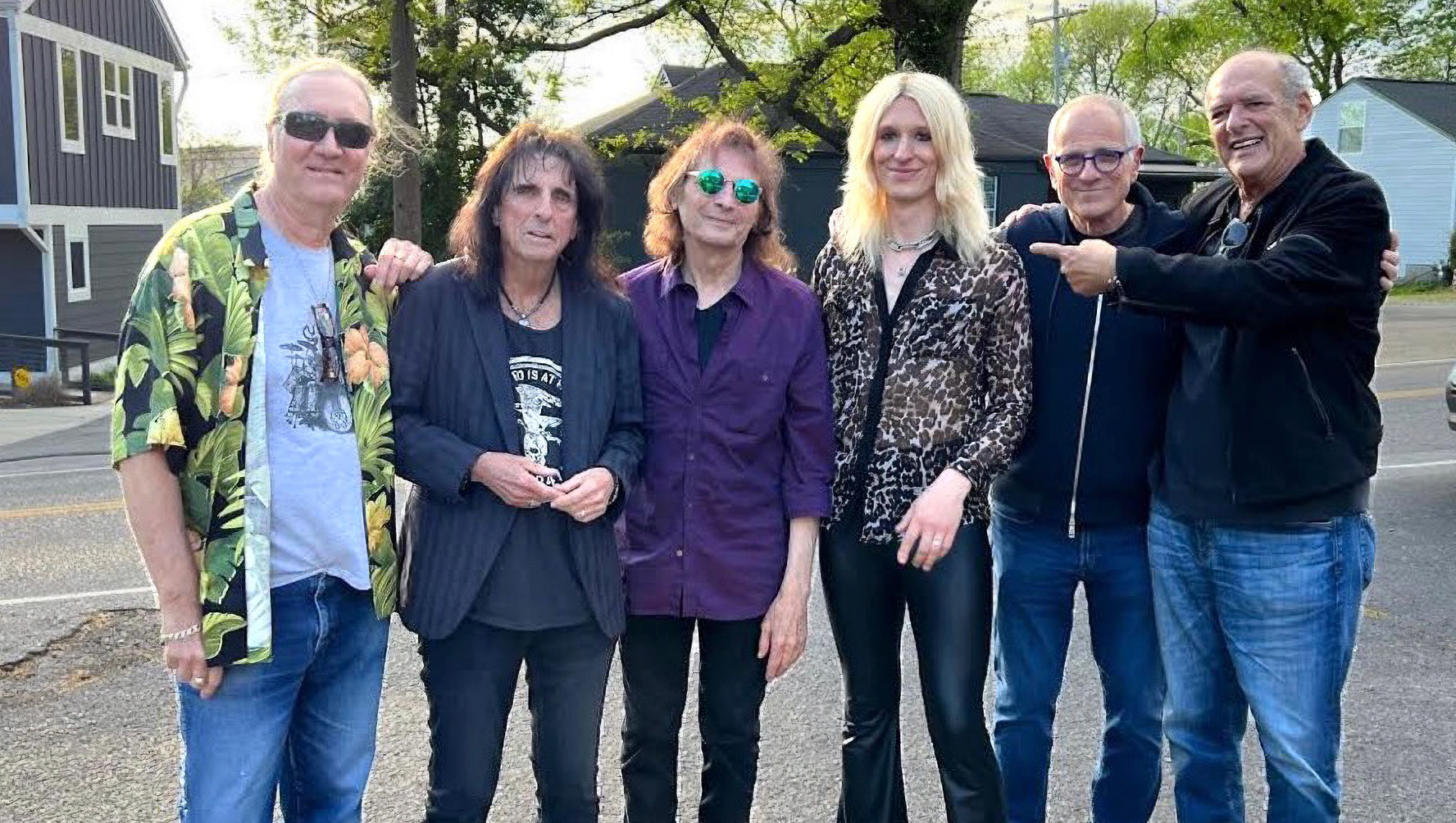 The Alice Cooper band lineup featuring original members and new guitarist Gyasi Heus (third from right)