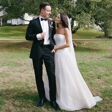 Adam and Jordan pose at their wedding.