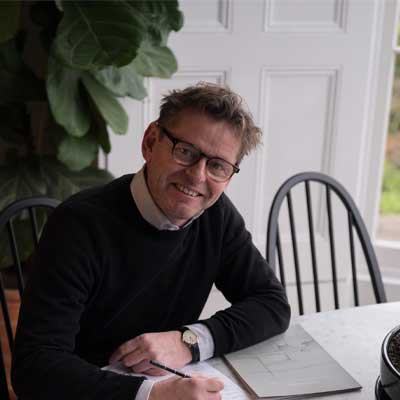 photo of kitchen expert Al Bruce a man sitting at a table wearing glasses
