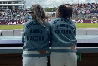 Eliza Huber and friend wearing denim Levi's x McLaren jackets and white jeans at the British Grand Prix.