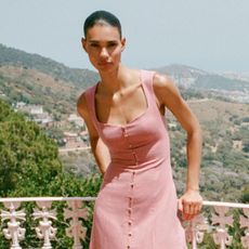 Woman wears linen-blend pink dress