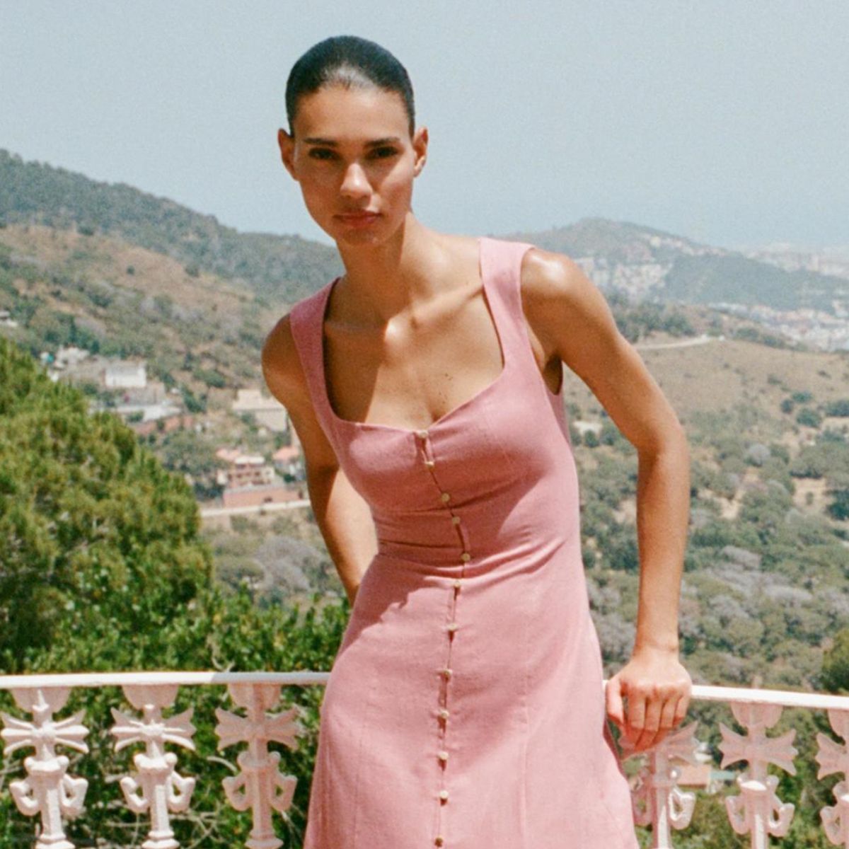 Woman wears linen-blend pink dress