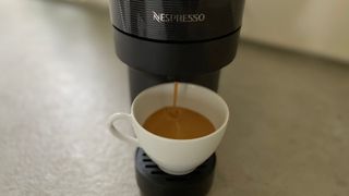 The Nespresso Vertuo Pop part of the way through brewing a coffee