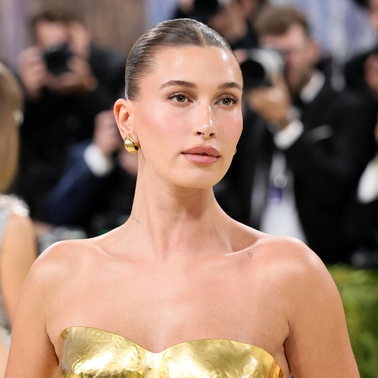 Hailey Bieber's Goddess Bun Is Just as Intentional as Her 24K-Gold Breastplate