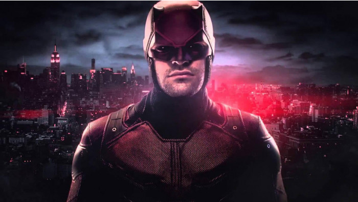 Daredevil standing in front of the New York skyline