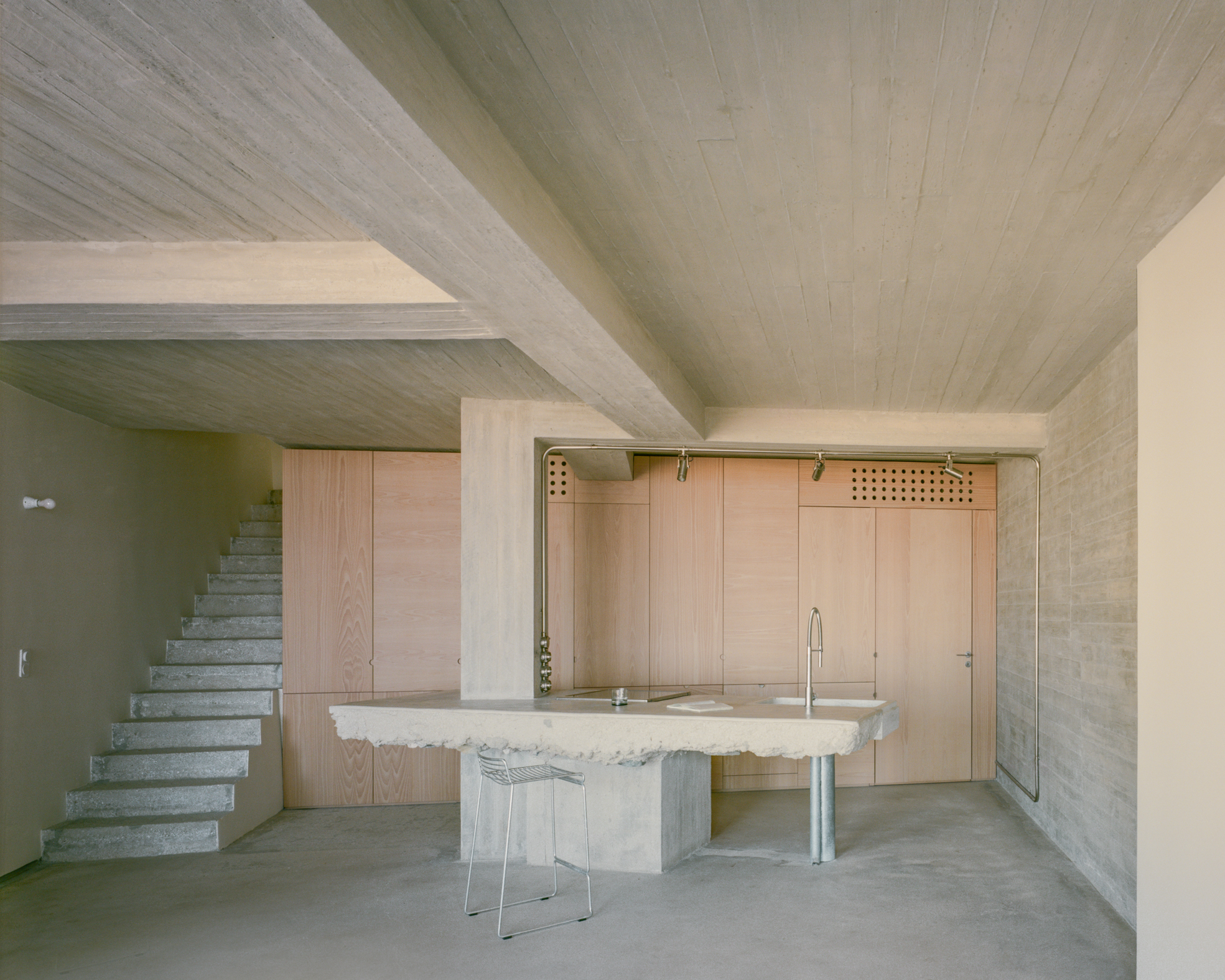 view of a Tinos house, using local vernacular such as stone walls and contemporary design