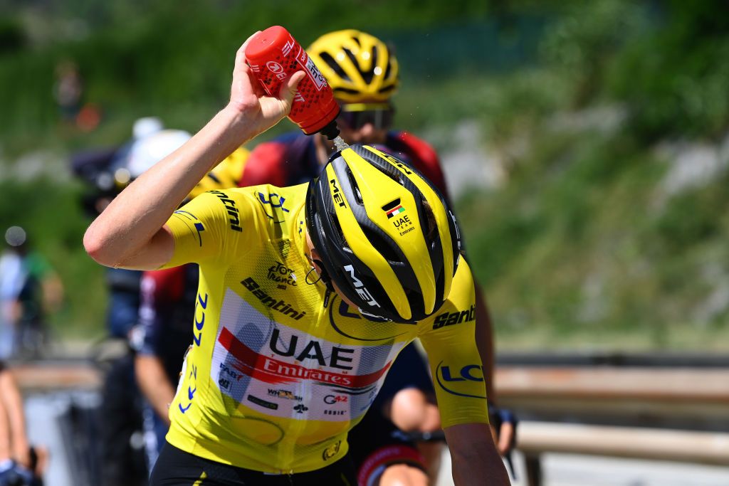 SERRE CHEVALIER FRANCE JULY 13 Tadej Pogacar of Slovenia and UAE Team Emirates Yellow Leader Jersey rides whilst refreshes himself during the 109th Tour de France 2022 Stage 11 a 1517km stage from Albertville to Col de Granon Serre Chevalier 2404m TDF2022 WorldTour on July 13 2022 in Col de GranonSerre Chevalier France Photo by Tim de WaeleGetty Images