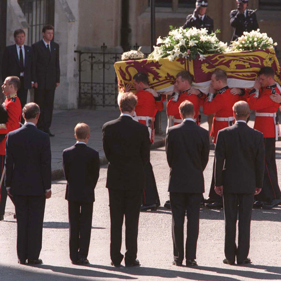 Men carrying Princess Diana&#039;s coffin with Prince Harry, Prince William, King Charles, Earl Spencer and Prince Philip facing it with their backs to the camera