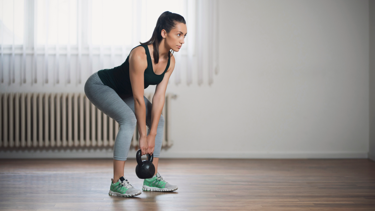 Woman doing a kettlebell RDL