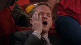 Neil Patrick Harris holding his face after being slapped on How I Met Your Mother.