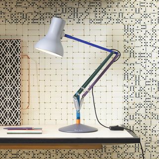 lamp on desk and designed tile wall