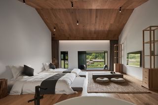 Bedrooms with understated palette of natural timbers