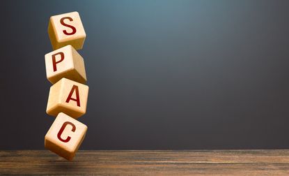 the acronym SPAC written on wooden blocks stacked on top of each other