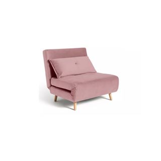A small chair bed upholstered in pink velvet