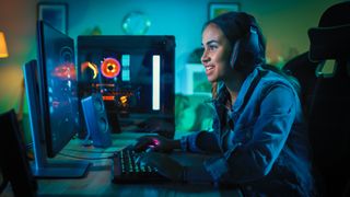 A young woman playing a game on a gaming PC