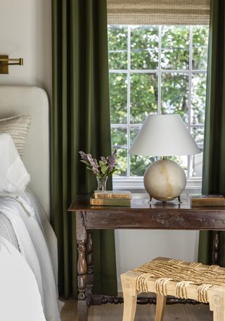 guest bedroom with flowers on the nightstand by Marie Flanigan