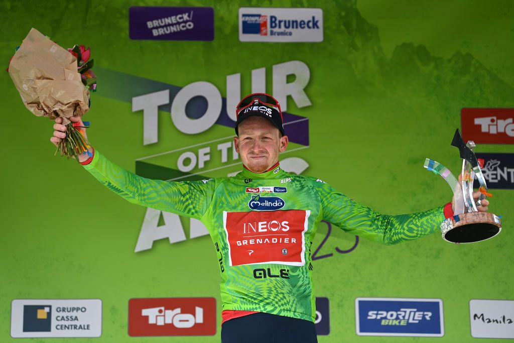 BRUNICO ITALY APRIL 21 Tao Geoghegan Hart of United Kingdom and Team INEOS Grenadiers Green Leader Jersey celebrates at podium as final overall winner during the 46th Tour of the Alps 2023 Stage 5 a 1445km stage from Cavalese to Brunico on April 21 2023 in Brunico Italy Photo by Tim de WaeleGetty Images