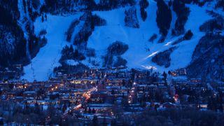 USA, Colorado, Aspen, elevated town view and Aspen Mountain, winter, dusk