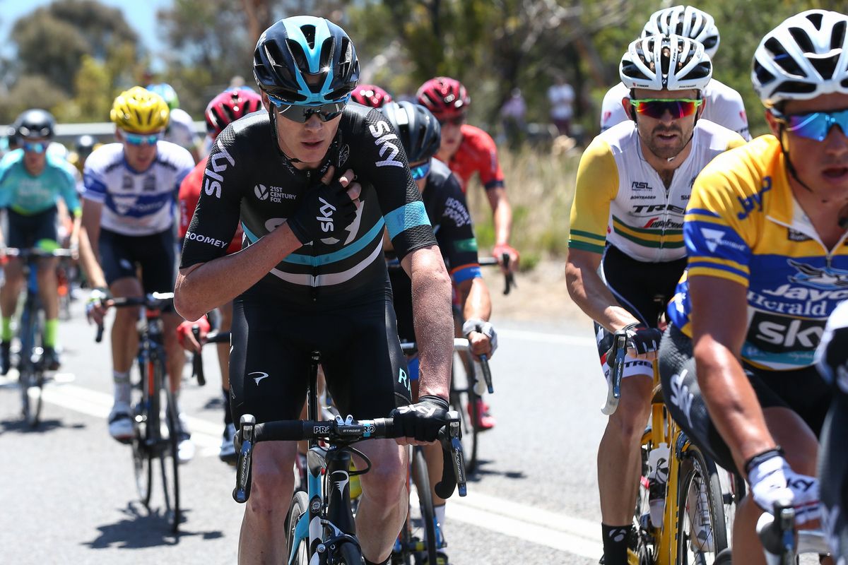 Chris Froome checks his radio