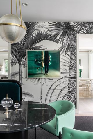a monochrome dining room with different shades of green