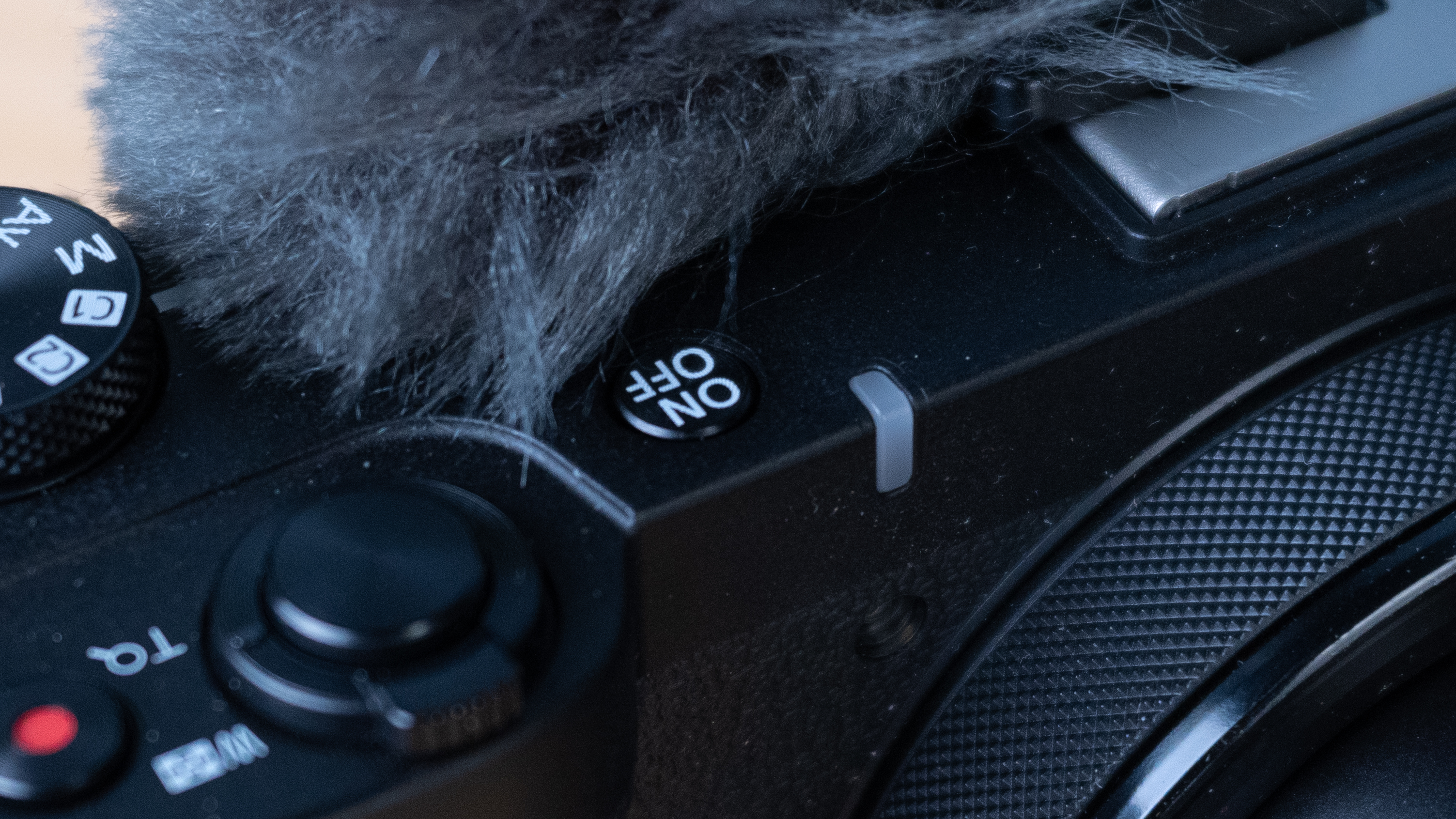 A black Canon PowerShot V1 compact vlogging camera