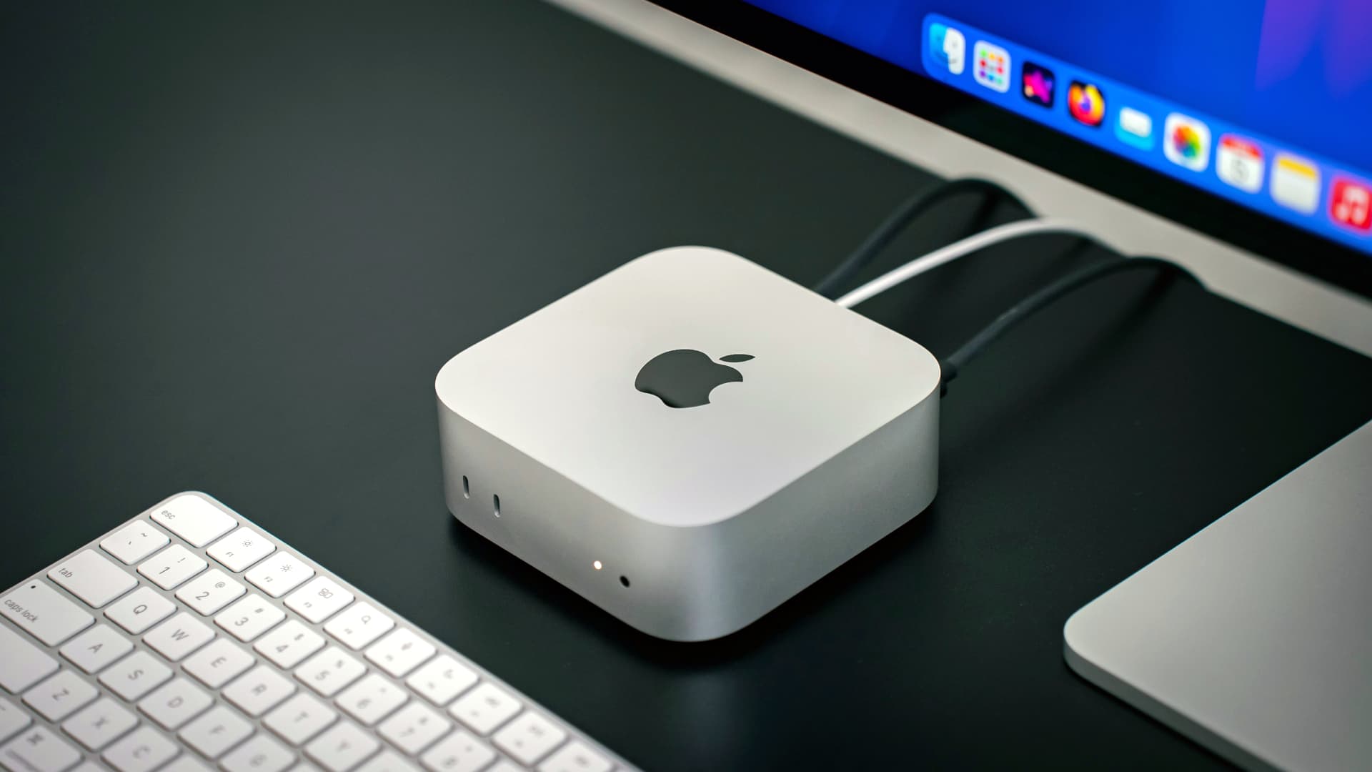 An Apple Mac mini on a desk.
