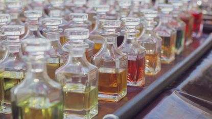 Perfume dupes - line-up of fragrance bottles 