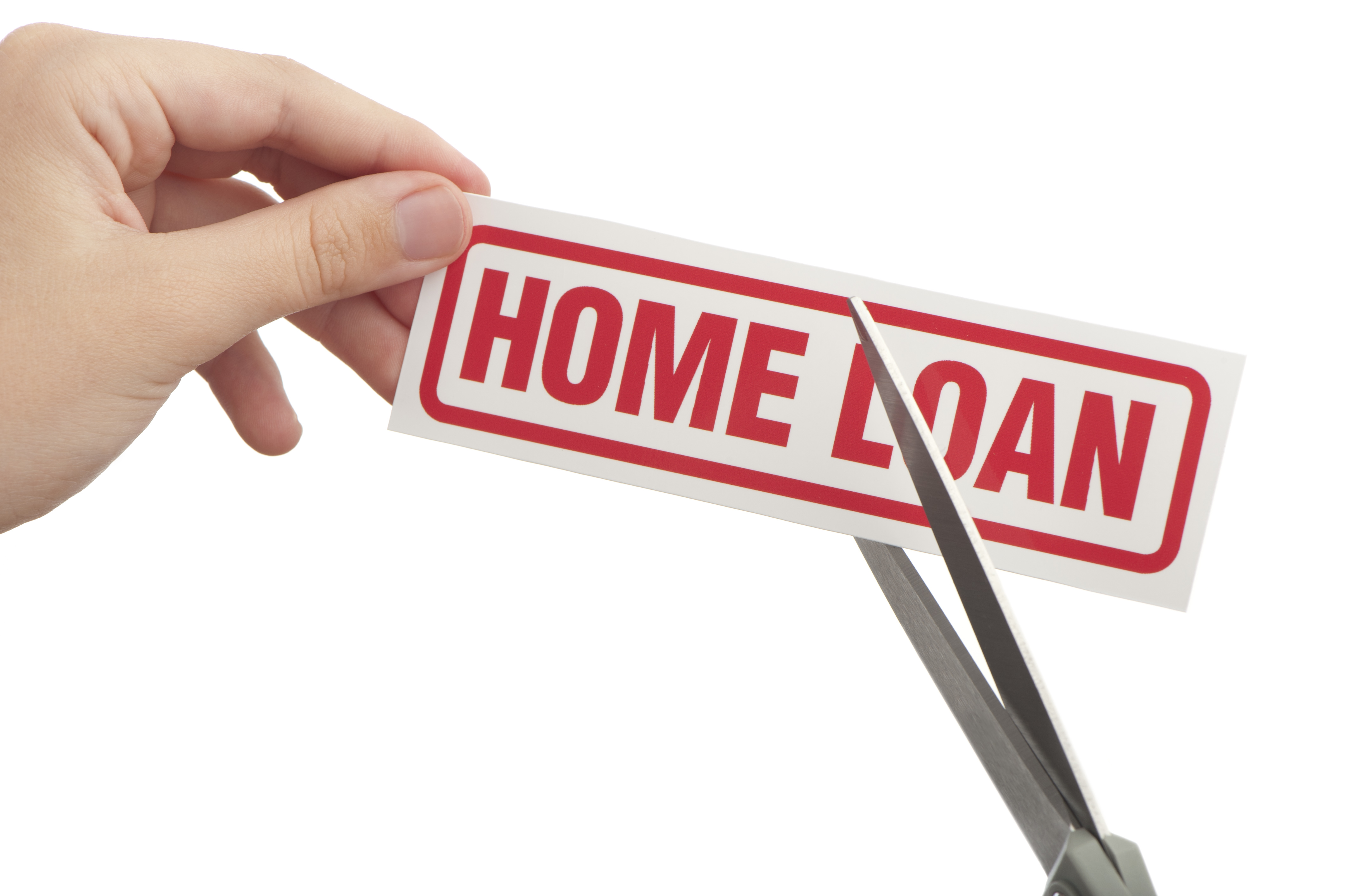 A woman's hand using scissors to cut through the words &amp;quot;home loan.&amp;quot;