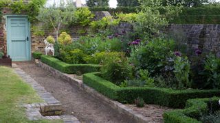 seating area in the corner of a walled garden