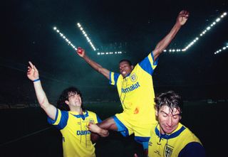 Faustino Asprilla is held aloft by Parma team-mates after victory over Juventus in the 1995 UEFA Cup final.