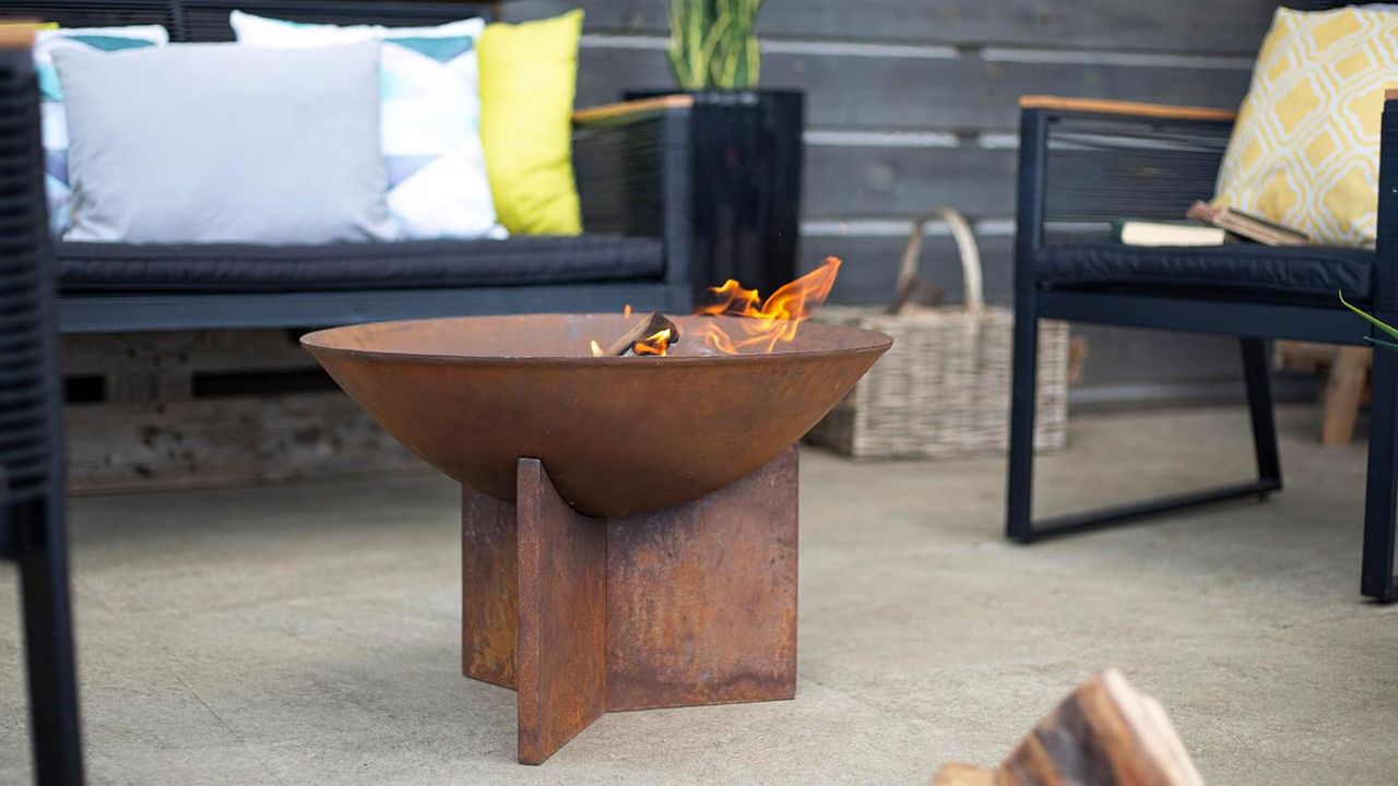 la hacienda fire pit on a patio with patio sofa set