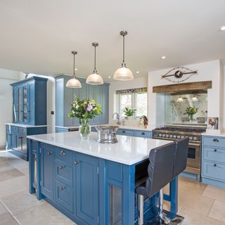 kitchen with blue cabinets and cookpot