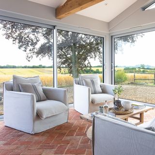 farmhouse with modern extension decorated in shades of grey and white