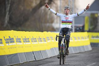 Dutch Mathieu Van Der Poel celebrates as he crosses the finish line to win the mens elite race of the Gullegem Cyclocross cycling event in Gullegem on January 2 2021 Photo by DAVID STOCKMAN BELGA AFP Belgium OUT Photo by DAVID STOCKMANBELGAAFP via Getty Images