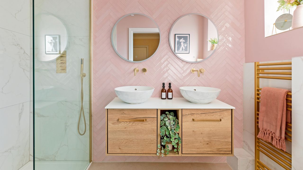 Bathroom with chevron pink tiled wall and double floating vanity unit