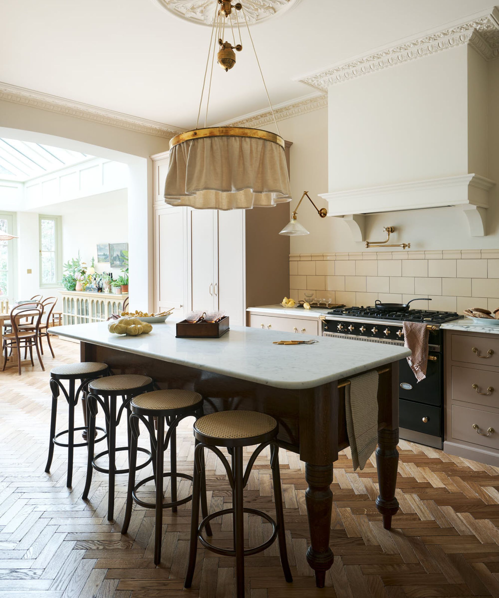 A pink and cream pinked with a traditional dairy table island
