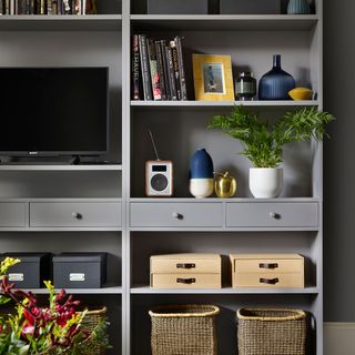 grey wooden shelves television clothes box