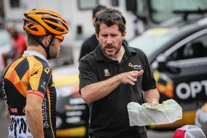 Optum team director Jonas Carney gives out some directions for the stage before the start.