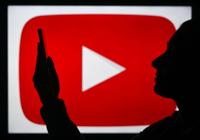 YouTube logo with a person watching a phone.