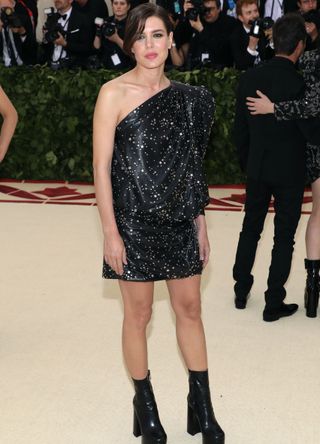 Princess Charlotte Casiraghi wearing a one-shoulder sparkly black dress at the Met Gala 2018