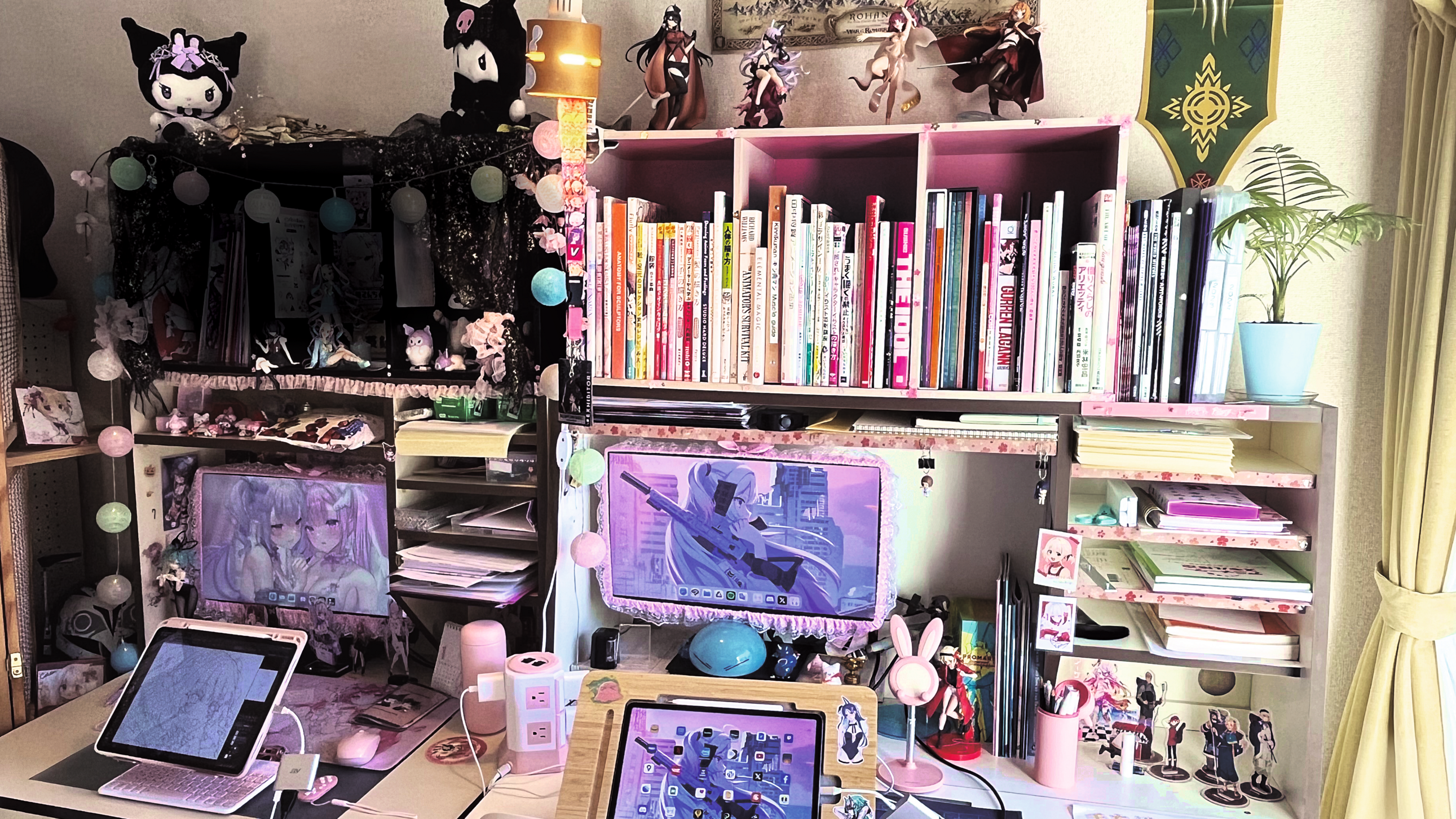 Artist's studio; an artist's workspace with bookshelf and computers