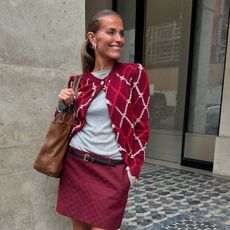 Polliani wearing Chanel cardigan