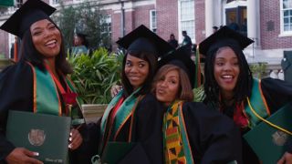 The Flossy Posse posing on graduation day in Girls Trip