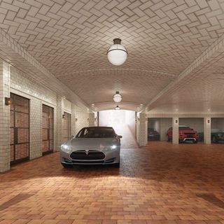 parking area with white ceiling lights and cars