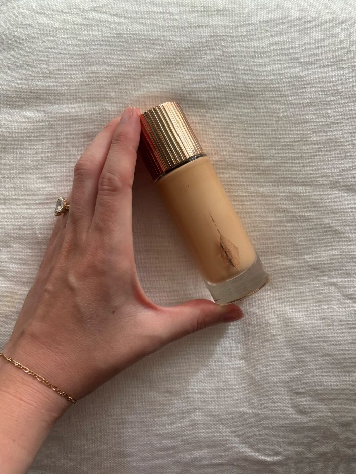 Deputy beauty editor Grace Lindsay holding the Charlotte Tilbury Hollywood Flawless Filter